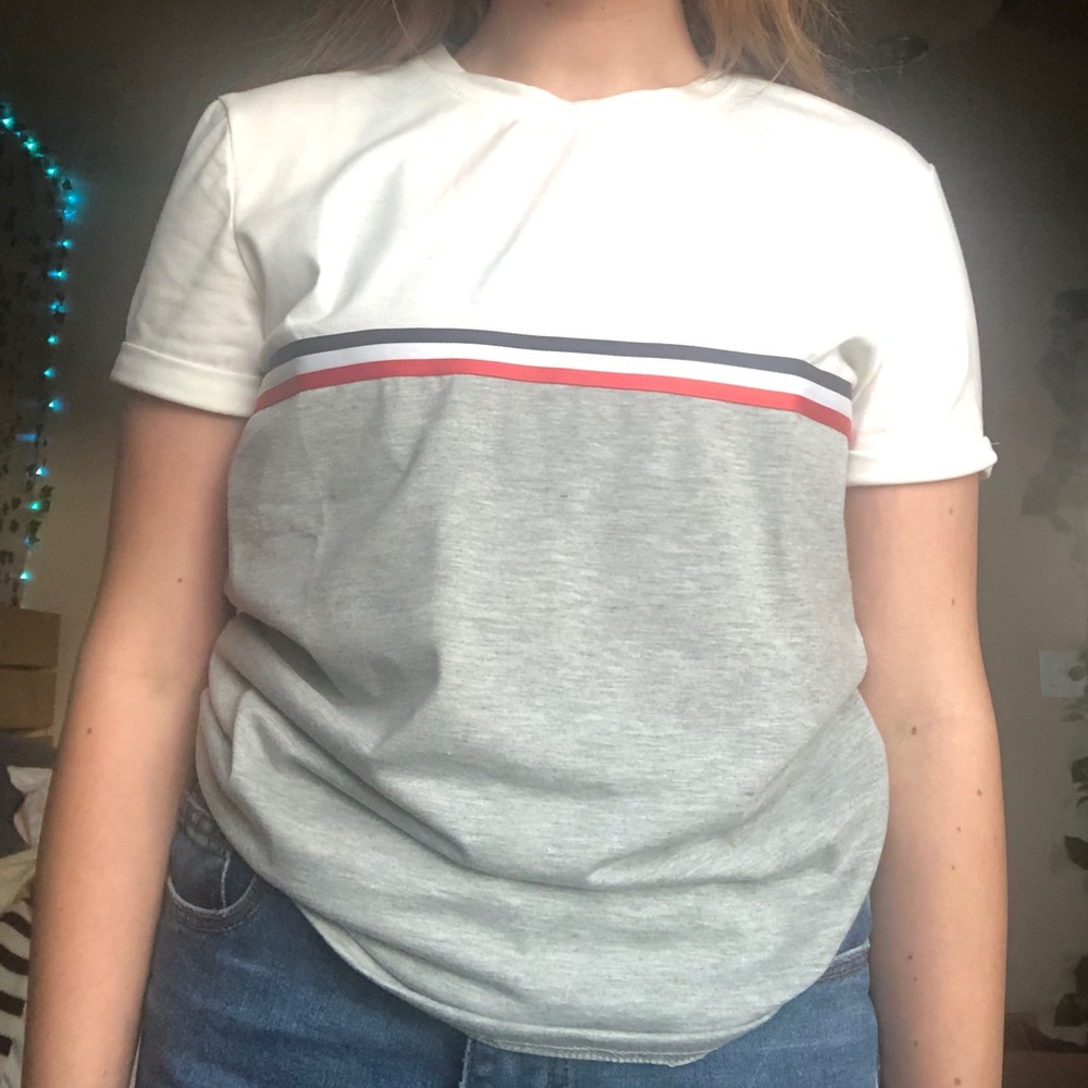 Tommy Hill figure looking tee